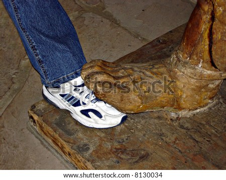 Wooden Big Foot and Leg in Jeans and Sneaker