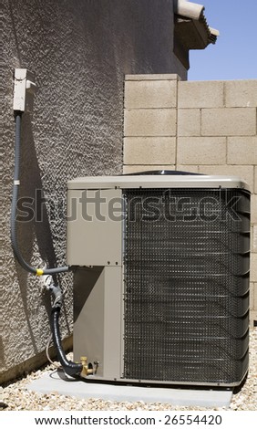 Air Conditioner and Heat Pump Compressor Unit in Backyard