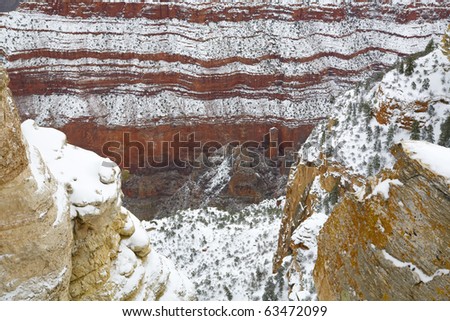 Colorful Grand Canyon walls in winter snow storm; South Rim at Mother Point, Arizona