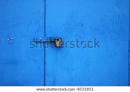 simple and effective background image of a padlock on a door painted bright blue