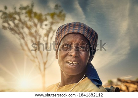 portrait of an old African woman at sunset in her village in Botswana