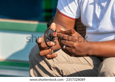 Image, Stock Photo Black man smoking in studio with neon illumination