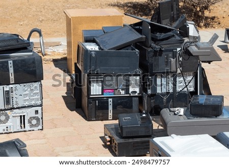 Similar – Image, Stock Photo Electronic scrap: Stacks of old mobile phone and smartphone parts