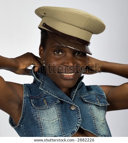 Sexy african American girl, in her twenties, no makeup, smiling, isolated on gray background