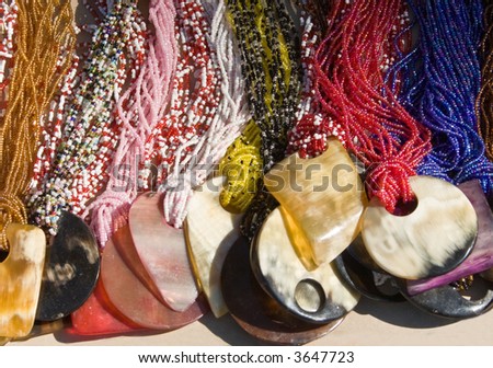 traditional African necklaces colorful, stone, shells, bits, design objects.
