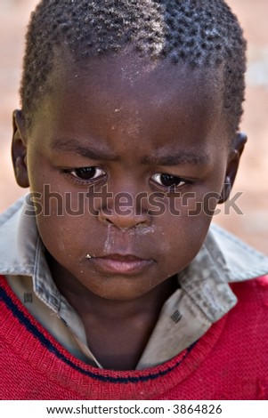 Deprived African child, village near Kalahari desert, people diversity series