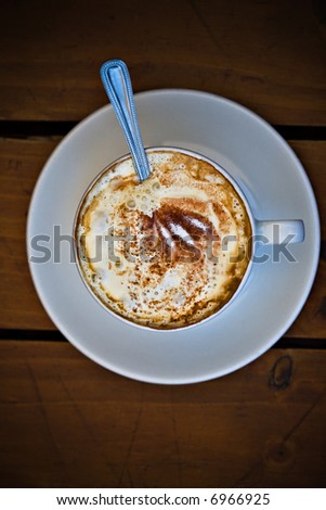 Cappuccino with cream, cup of coffee, vintage warm look