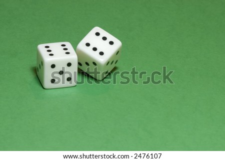 Gambling dices on green casino table background (also available on white or black backgrounds)