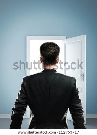 man in blue room with doors open
