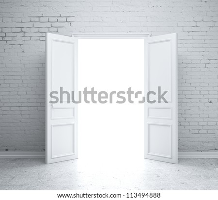 open door in brick wall - stock photo