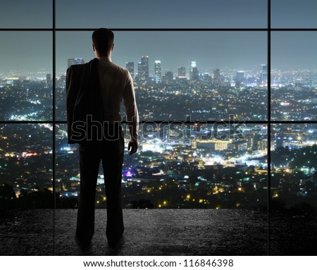 businessman looks in night city