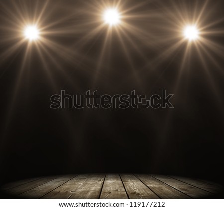 stage spot lighting over dark background