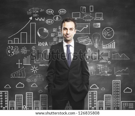 man with hands in pocket and drawing business concept
