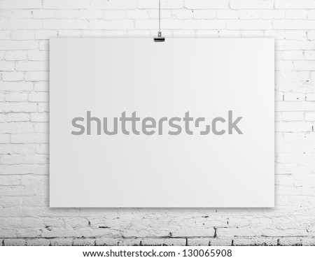 brick wall with white poster