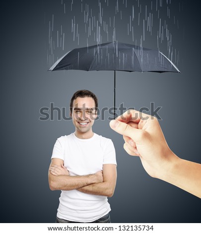 hand of a man with an umbrella closes to rain