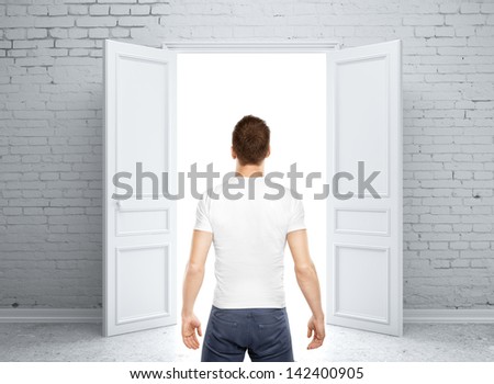 man standing back and opened door