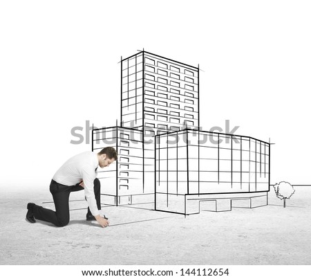 businessman drawing skyscraper on a white background