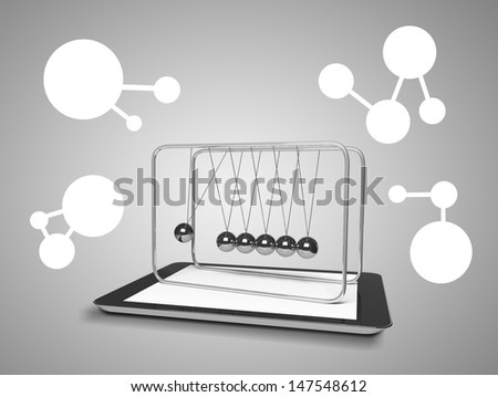 touch pad and newton\'s cradle on a gray background