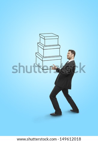 businessman holding drawing box on blue background
