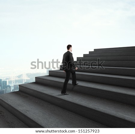 businessman walking near ladder in sky