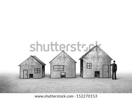 man in suit drawing concrete houses