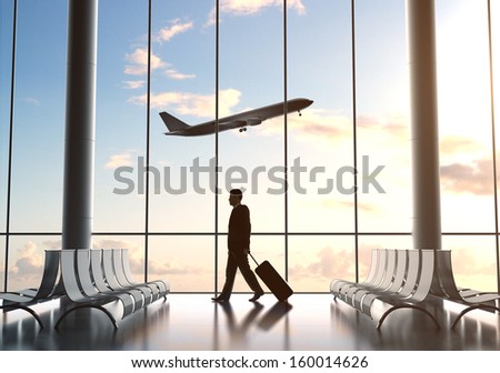young man in airport and airplane in sky
