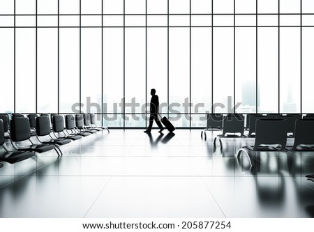 businessman in airport with luggage