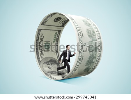 businessman running in money wheel  on blue background