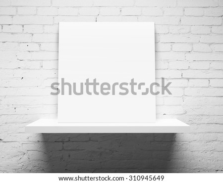 brick wall and white shelf with poster