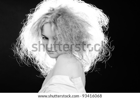 Sensual woman with fluffy hair. Black and white.