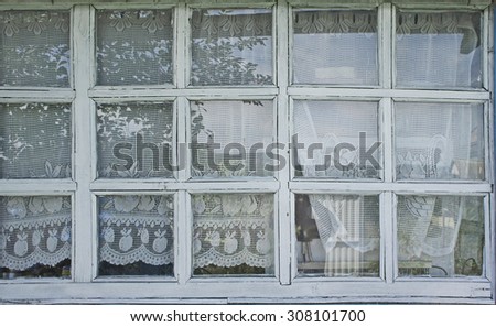 Window of the porch in a rustic cabin