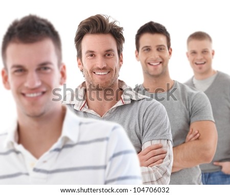 Group portrait of happy young men, looking at camera, smiling.