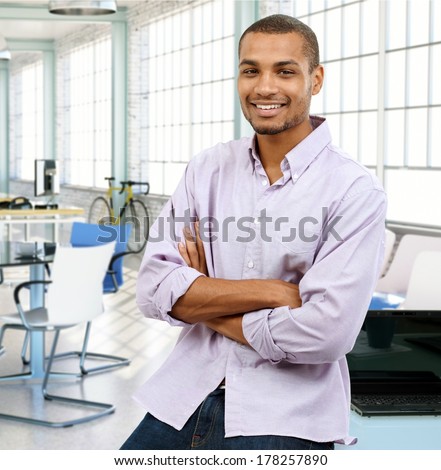 Portrait of a happy casual black man at modern office.