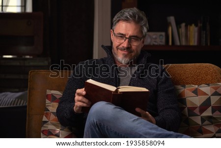 Similar – Image, Stock Photo Mature man reading book at home