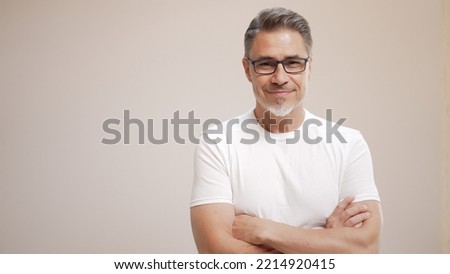 Similar – Image, Stock Photo Portrait of mature man with grey beard exploring Finland in winter. Traveler with camera on the top of rock. Beautiful view of northern landscape with frozen Baltic Sea and snowy islands.