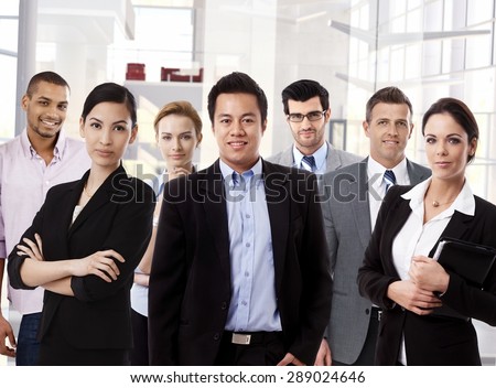 Team portrait of multi ethnic business group at office.