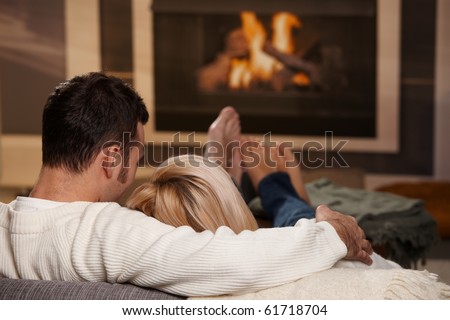Similar – Image, Stock Photo Romantic couple cuddling in blanket on terrace