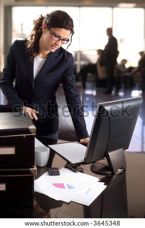 Young businesswoman works in the lobby of the bank.