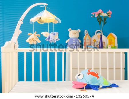 Crib and soft baby toys at children\'s room. Toys are officially property released.