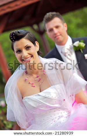 Wedding bride and groom together outdoors, smiling, portrait.