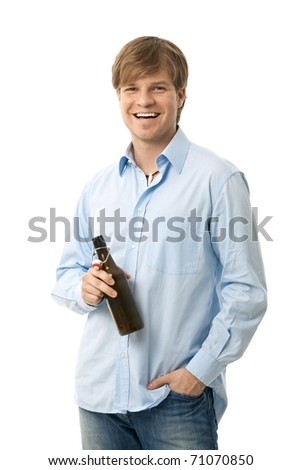 Casual Young Man Holding Bottle Of Beer, Smiling. Isolated On White ...