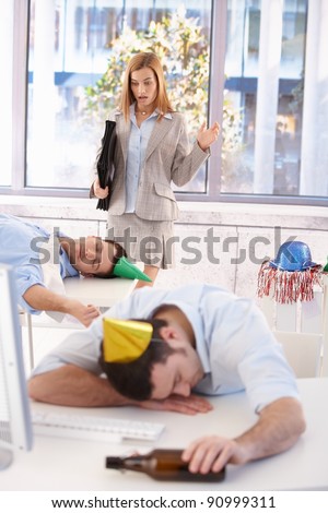 Attractive businesswoman discovers mess in office after last night party.?