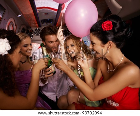 Party fun with champagne in limousine.?