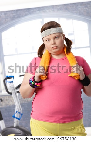 Exhausted fat woman after workout at the gym.?