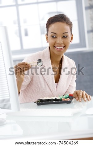 Similar – Image, Stock Photo Ethnic businesswoman eating sushi and working on laptop in cafe