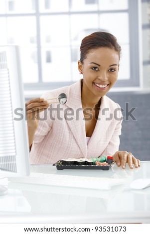 Similar – Image, Stock Photo Ethnic businesswoman eating sushi and working on laptop in cafe