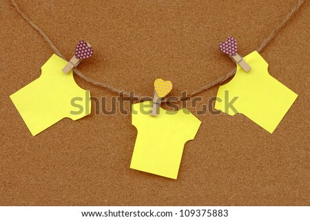 Cork board with yellow notes.