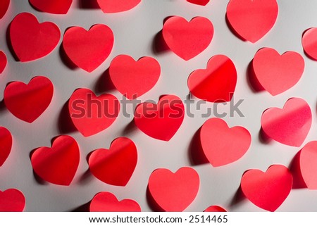 Mass of red post-it papers shaped like Valentine´s hearts