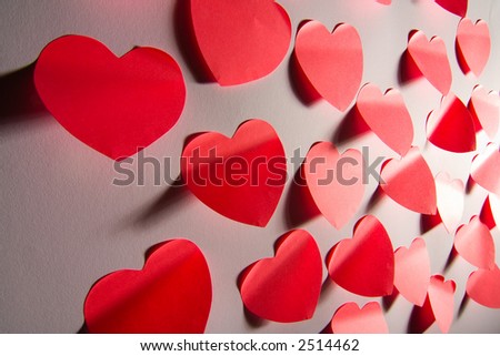 Mass of red post-it papers shaped like Valentine´s hearts