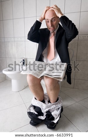 Man reading newspaper on toilet, expressing surprise at what he is reading